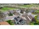 Aerial view of a residential neighborhood featuring mature landscaping and solar panels at 10052 Sage Sparrow Ct, Highlands Ranch, CO 80129