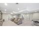 The finished basement features a seating area with couch and bonus recreation space at 10052 Sage Sparrow Ct, Highlands Ranch, CO 80129