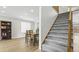 View of staircase with carpet leading from the living room and dining area to the second floor at 10052 Sage Sparrow Ct, Highlands Ranch, CO 80129