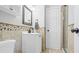 Bathroom featuring tiled walls, a white vanity, new fixtures, and a glass-enclosed shower at 10052 Sage Sparrow Ct, Highlands Ranch, CO 80129