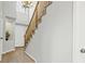 Bright entryway with wood floors and staircase leading upstairs at 10052 Sage Sparrow Ct, Highlands Ranch, CO 80129