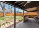 Covered outdoor patio area with custom bar great for entertaining with view of the backyard at 1320 Locust St, Denver, CO 80220