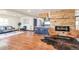 Open living room features hardwood floors, fireplace, and modern decor. Seating includes two sofas and leather chairs at 1320 Locust St, Denver, CO 80220