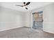 Bedroom with balcony access and ceiling fan at 165 S Sable Blvd # R14, Aurora, CO 80012