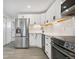 Updated kitchen with stainless steel appliances and white cabinetry at 165 S Sable Blvd # R14, Aurora, CO 80012