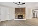 Living room with a stone fireplace and wood accent wall at 165 S Sable Blvd # R14, Aurora, CO 80012
