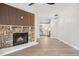 Open living room showcasing a fireplace and kitchen view at 165 S Sable Blvd # R14, Aurora, CO 80012