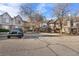 View of condo building and parking lot with a Jeep parked at 165 S Sable Blvd # R14, Aurora, CO 80012