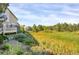 This lush backyard is partially wooded and features a pond at 8835 Edinburgh Cir, Highlands Ranch, CO 80129