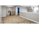 Carpeted bonus room offering neutral walls, wood staircase with nautical decor, and a railing at 8835 Edinburgh Cir, Highlands Ranch, CO 80129