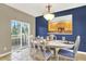 Elegant dining room with sliding doors to a deck and views of the backyard at 8835 Edinburgh Cir, Highlands Ranch, CO 80129