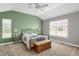 Comfortable main bedroom showcasing a queen bed, vaulted ceiling, a ceiling fan, and a well-lit window at 8835 Edinburgh Cir, Highlands Ranch, CO 80129