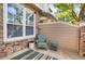 Cozy outdoor seating area with stone accents and blue-green furniture at 8835 Edinburgh Cir, Highlands Ranch, CO 80129