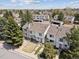 Aerial view showcases townhomes with private parking and lush landscaping at 4117 S Mobile Cir # C, Aurora, CO 80013