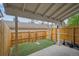 An outdoor yard with artificial grass and a wood fence at 4117 S Mobile Cir # C, Aurora, CO 80013