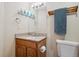 Bathroom vanity with granite counter top and blue glass decor at 4117 S Mobile Cir # C, Aurora, CO 80013