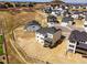 Aerial view of a newly constructed home on a spacious lot in a residential neighborhood at 5722 Farrier Pt, Castle Rock, CO 80104