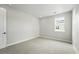 Vacant bedroom featuring carpet, trim and window at 5722 Farrier Pt, Castle Rock, CO 80104