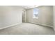 Bedroom featuring carpet, a window and trim with a door at 5722 Farrier Pt, Castle Rock, CO 80104