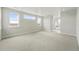 Spacious main bedroom with carpet, natural light, and bathroom access at 5722 Farrier Pt, Castle Rock, CO 80104