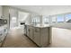Spacious kitchen island featuring stainless steel dishwasher, cabinets, and sink at 5722 Farrier Pt, Castle Rock, CO 80104