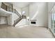 Open-concept living area with tall ceilings, fireplace and access to the deck at 5722 Farrier Pt, Castle Rock, CO 80104