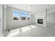 Bright living room with large windows and fireplace at 5722 Farrier Pt, Castle Rock, CO 80104