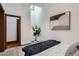 Bright bedroom with a stylish bed, skylight and adjacent closet with elegant trim work at 320 E Dakota Ave, Denver, CO 80209