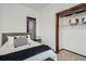 Comfortable bedroom featuring a plush bed, decorative pillows, and closet storage at 320 E Dakota Ave, Denver, CO 80209