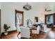 Open floor plan with dining room flowing into the living room, showcasing hardwood floors at 320 E Dakota Ave, Denver, CO 80209