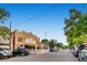 Charcoal Bistro with outdoor seating options on a vibrant street with mature shade trees at 320 E Dakota Ave, Denver, CO 80209