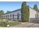 Unique townhome design, showcasing the lush front garden and interesting architecture at 320 E Dakota Ave, Denver, CO 80209