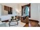 Cozy living room with hardwood floors, stylish furniture, and a large window for natural light at 320 E Dakota Ave, Denver, CO 80209