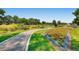 Scenic view of a neighborhood park with walking paths and colorful flowerbeds at 320 E Dakota Ave, Denver, CO 80209
