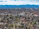 Breathtaking aerial view of the city skyline, mountains, and surrounding landscape at 1419 Dexter St, Denver, CO 80220
