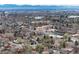 Panoramic aerial view of the city and surrounding neighborhoods, filled with mature trees at 1419 Dexter St, Denver, CO 80220
