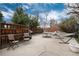 The fenced-in backyard features a patio with a picnic table, chairs, a grill, and a relaxing hammock at 1419 Dexter St, Denver, CO 80220