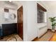 Charming entryway featuring a decorative rug, coat closet, and ample natural light at 1419 Dexter St, Denver, CO 80220