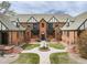 Unique complex offers appealing architecture, lovely courtyard with fountain, and relaxing curb appeal at 1419 Dexter St, Denver, CO 80220