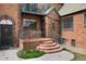 Attractive brick building featuring a cozy porch and an inviting entrance at 1419 Dexter St, Denver, CO 80220