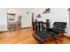 Sitting area with hardwood flooring, record player, and Eames-style chair and ottoman at 1419 Dexter St, Denver, CO 80220