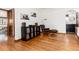 Sitting area with hardwood flooring, record player, and Eames-style chair and ottoman at 1419 Dexter St, Denver, CO 80220