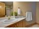 Cozy bathroom with a vanity and a shower with natural lighting for a tranquil setting at 2191 Baldy Ln, Evergreen, CO 80439