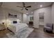 Serene bedroom with hardwood floors, a ceiling fan, and soft lighting, creating a relaxing atmosphere at 2191 Baldy Ln, Evergreen, CO 80439