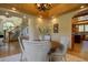 Dining room features a round wood table with soft cushioned seating and stylish decor at 2191 Baldy Ln, Evergreen, CO 80439