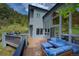 Beautiful exterior view of a house with large windows overlooking the surrounding trees at 2191 Baldy Ln, Evergreen, CO 80439