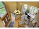 Grand foyer with hardwood floors, staircase, and a view of the living area at 2191 Baldy Ln, Evergreen, CO 80439