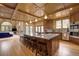Spacious kitchen island with granite countertop and seating, plus modern appliances at 2191 Baldy Ln, Evergreen, CO 80439