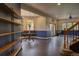 Bright living room boasting wood floors, large windows and elegant lighting fixtures at 2191 Baldy Ln, Evergreen, CO 80439