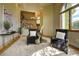 Bright living area with plush seating, modern decor, and staircase in background at 2191 Baldy Ln, Evergreen, CO 80439